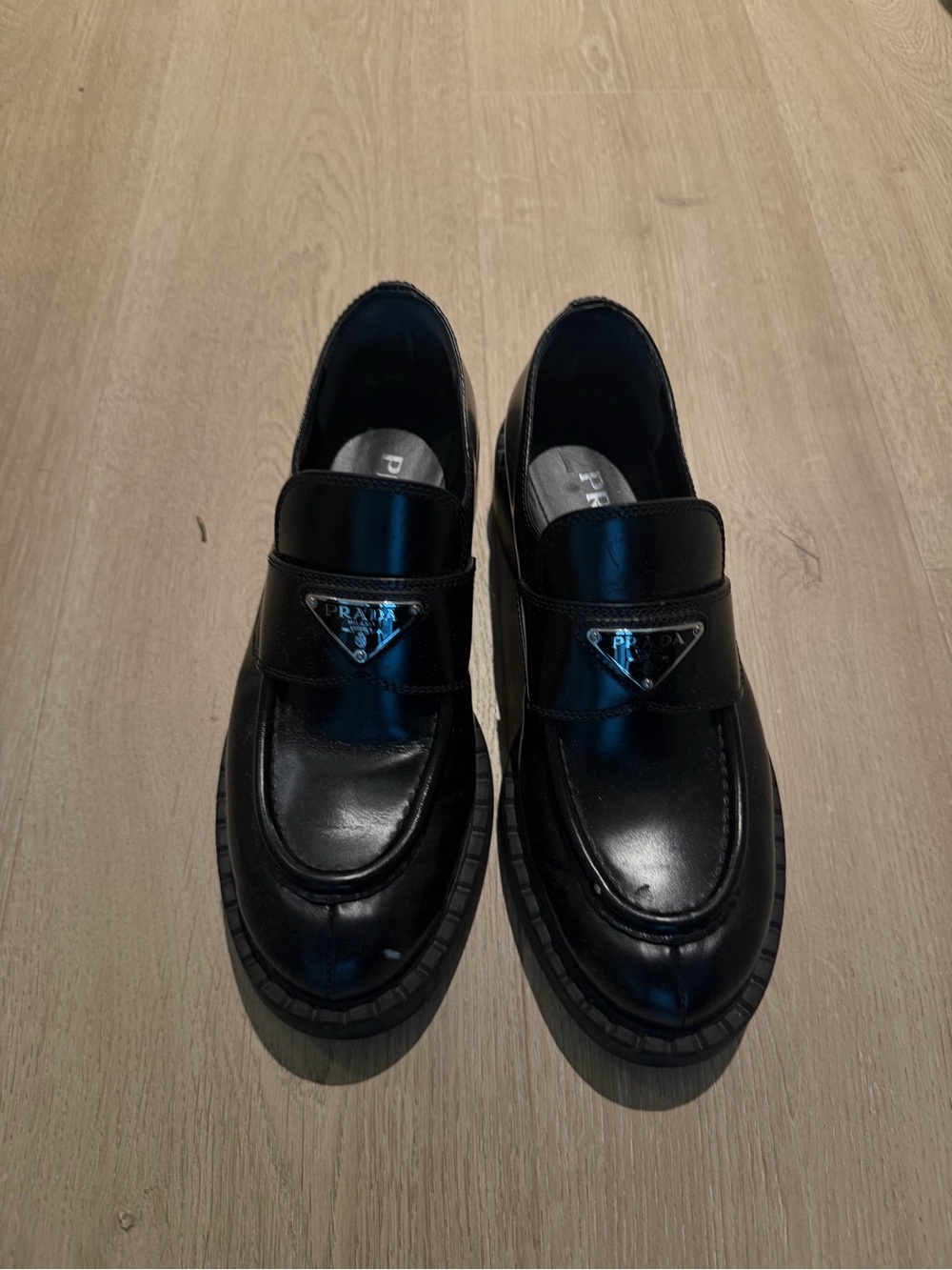 Prada Black Leather Penny Strap Loafers with Logo Plaque